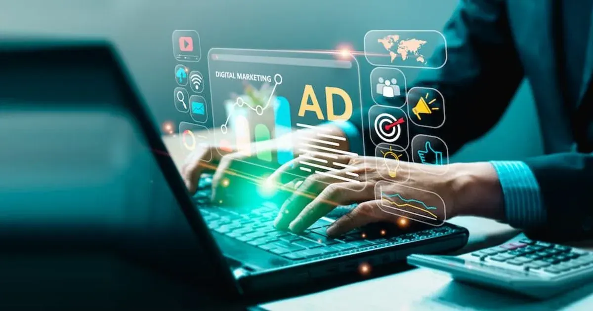Person typing on a laptop with digital ad and marketing icons over the screen Person typing on a laptop with digital ad and marketing icons over the screen