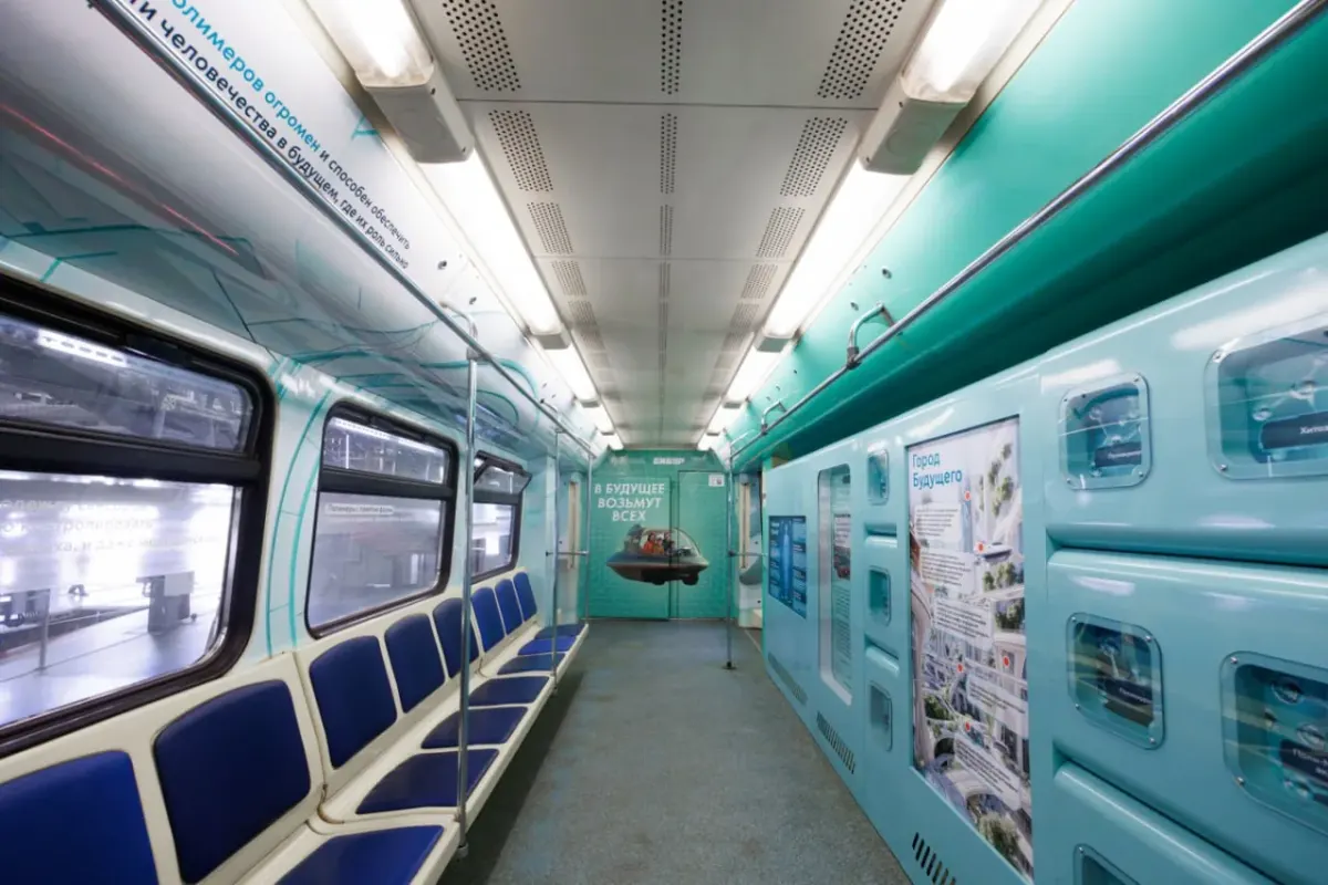 Modern metro train interior with blue seats and teal walls Modern metro train interior with blue seats and teal walls